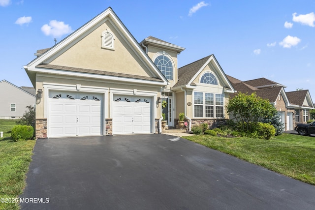 78 Honeysuckle Dr, Manahawkin, NJ 08050 - traditional-style home with stone siding, stucco siding, and asphalt driveway