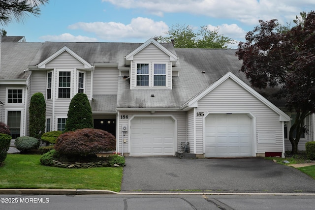 186 Snow Drop Pl, Freehold, NJ 07728 - view of front of home with driveway and an attached garage