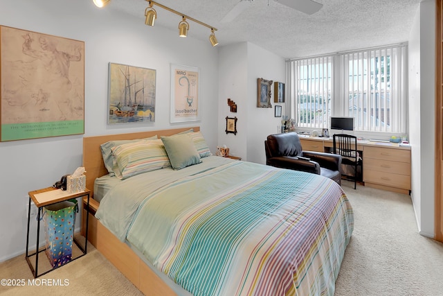 186 Snow Drop Pl, Freehold, NJ 07728 - bedroom featuring light carpet, a textured ceiling, and an office area