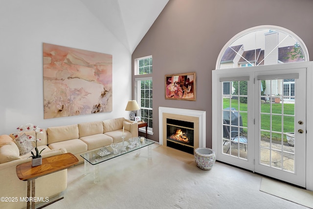 186 Snow Drop Pl, Freehold, NJ 07728 - carpeted living room featuring high vaulted ceiling and a fireplace with flush hearth