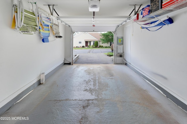 186 Snow Drop Pl, Freehold, NJ 07728 - garage featuring a garage door opener and baseboards