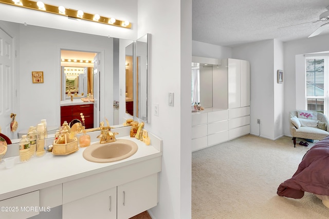 186 Snow Drop Pl, Freehold, NJ 07728 - bathroom with vanity, ensuite bath, a textured ceiling, and ceiling fan