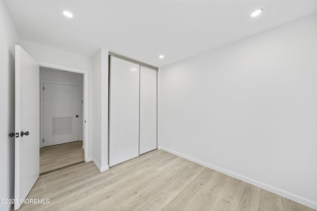 410 Owls Nest Ct, Jackson, NJ 08527 - unfurnished bedroom with light wood-style flooring, a closet, and recessed lighting