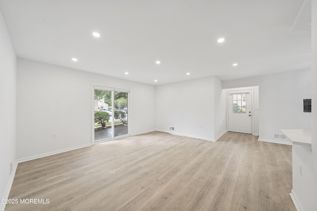 410 Owls Nest Ct, Jackson, NJ 08527 - unfurnished living room featuring healthy amount of natural light, light wood-style floors, and recessed lighting