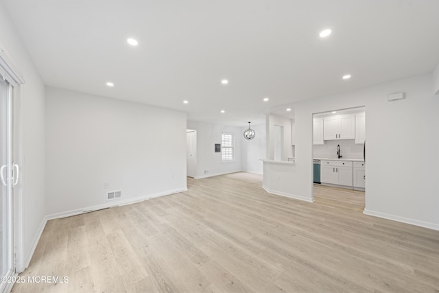 410 Owls Nest Ct, Jackson, NJ 08527 - unfurnished living room featuring light wood-style floors and recessed lighting