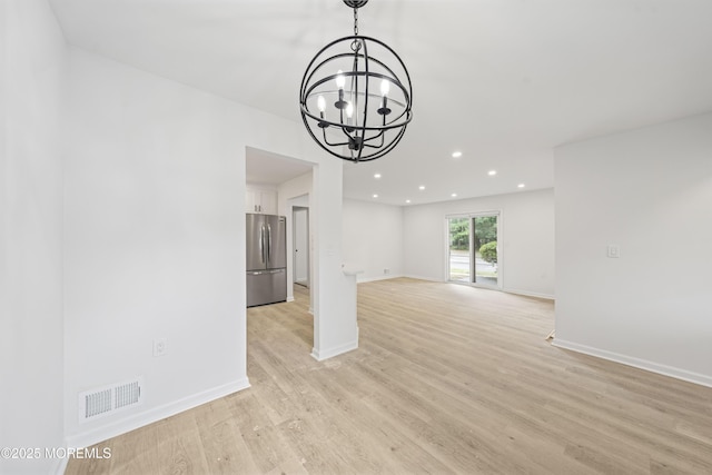 410 Owls Nest Ct, Jackson, NJ 08527 - unfurnished living room with a chandelier, light wood-type flooring, and recessed lighting