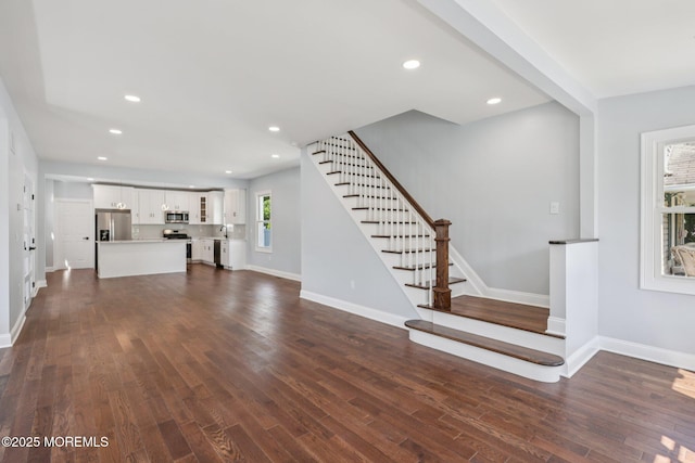 68 Cypress St, Long Branch, NJ 07740 - unfurnished living room featuring stairs, dark wood-style floors, and recessed lighting