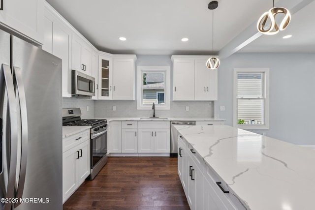 68 Cypress St, Long Branch, NJ 07740 - kitchen featuring appliances with stainless steel finishes, plenty of natural light, dark wood-style floors, white cabinets, and recessed lighting