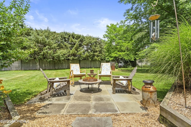 11 Sharon Dr, Ocean Twp, NJ 07712 - fenced backyard with an outdoor fire pit and a patio