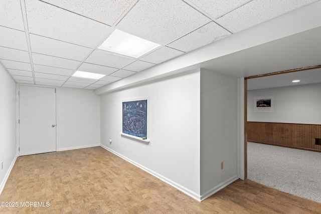 11 Sharon Dr, Ocean Twp, NJ 07712 - finished basement featuring a drop ceiling, light wood finished floors, and wood walls