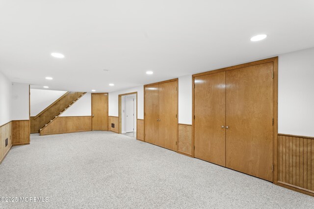 11 Sharon Dr, Ocean Twp, NJ 07712 - finished basement with a wainscoted wall, wood walls, stairway, recessed lighting, and carpet floors