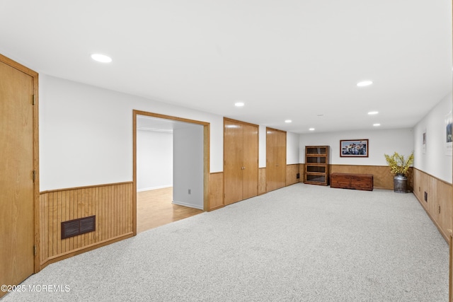 11 Sharon Dr, Ocean Twp, NJ 07712 - finished below grade area with a wainscoted wall, carpet flooring, and wooden walls