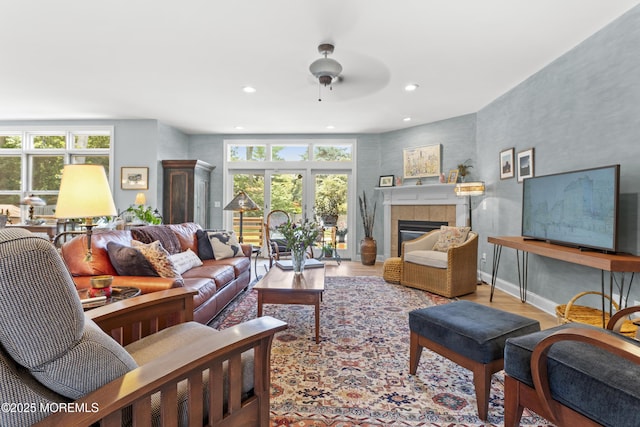 11 Sharon Dr, Ocean Twp, NJ 07712 - living room featuring healthy amount of natural light, a tile fireplace, wood finished floors, a ceiling fan, and recessed lighting