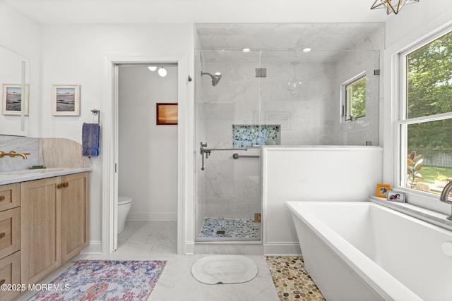 11 Sharon Dr, Ocean Twp, NJ 07712 - full bathroom with marble finish flooring, a freestanding tub, a shower stall, and vanity