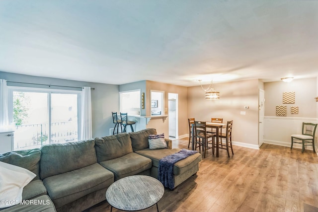 65 Cedar Ave Unit C10, Long Branch, NJ 07740 - living room with light wood-type flooring and a chandelier