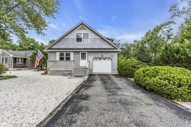 211 Meadow Blvd, Brick, NJ 08723 - view of front of property featuring a garage, asphalt driveway, and board and batten siding