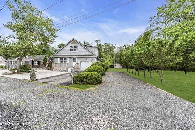 211 Meadow Blvd, Brick, NJ 08723 - view of front facade featuring gravel driveway, board and batten siding, and a front yard