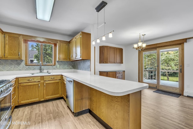 211 Meadow Blvd, Brick, NJ 08723 - kitchen featuring a peninsula, light wood-type flooring, and light countertops