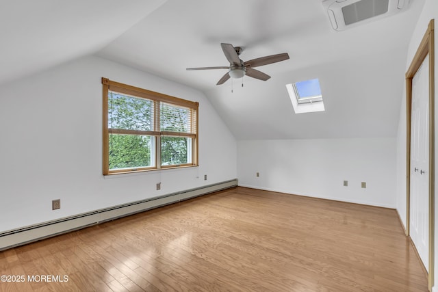211 Meadow Blvd, Brick, NJ 08723 - bonus room with baseboard heating, a skylight, vaulted ceiling, light wood-style floors, and a ceiling fan