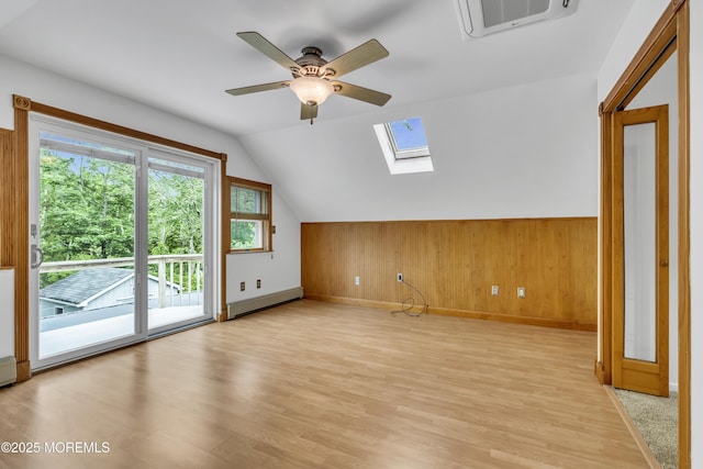 211 Meadow Blvd, Brick, NJ 08723 - bonus room with a skylight, ceiling fan, light wood-type flooring, lofted ceiling, and wood walls