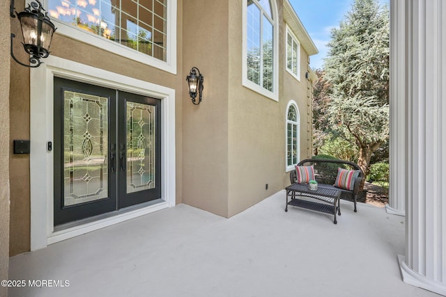 9 Old Cider Mill Rd, Manalapan, NJ 07726 - entrance to property with stucco siding, french doors, and a patio
