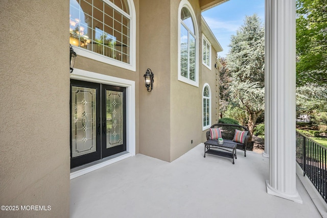 9 Old Cider Mill Rd, Manalapan, NJ 07726 - property entrance with stucco siding and a patio area