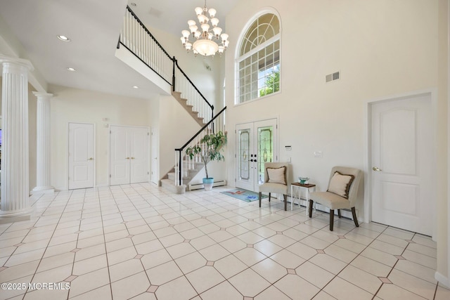 9 Old Cider Mill Rd, Manalapan, NJ 07726 - entrance foyer featuring stairway, a towering ceiling, a baseboard radiator, ornate columns, and french doors