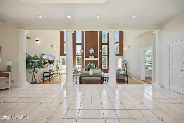 9 Old Cider Mill Rd, Manalapan, NJ 07726 - living area with decorative columns, recessed lighting, and a high ceiling