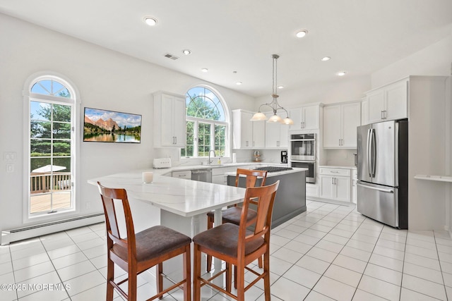 9 Old Cider Mill Rd, Manalapan, NJ 07726 - kitchen with stainless steel appliances, a baseboard heating unit, white cabinetry, and recessed lighting