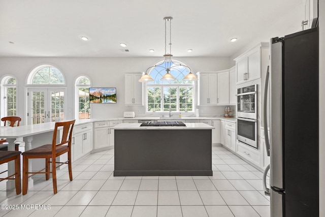 9 Old Cider Mill Rd, Manalapan, NJ 07726 - kitchen featuring stainless steel appliances, light countertops, white cabinetry, decorative light fixtures, and recessed lighting