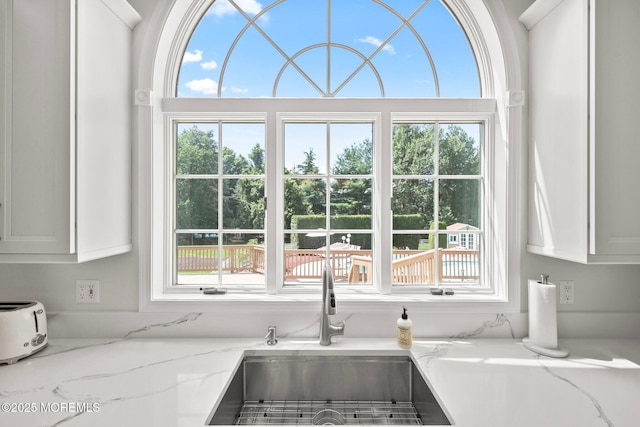 9 Old Cider Mill Rd, Manalapan, NJ 07726 - kitchen featuring plenty of natural light, white cabinets, and light stone countertops