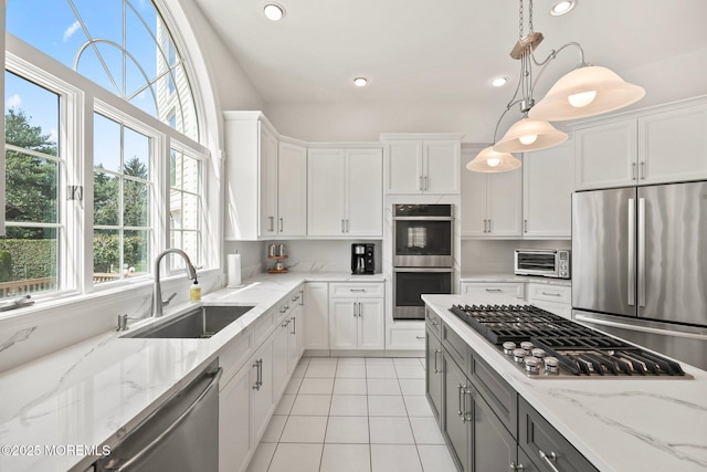 9 Old Cider Mill Rd, Manalapan, NJ 07726 - kitchen featuring appliances with stainless steel finishes, white cabinets, light tile patterned floors, decorative light fixtures, and recessed lighting