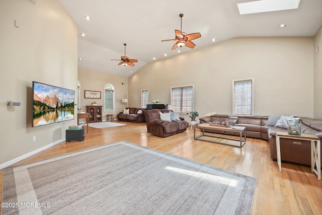 9 Old Cider Mill Rd, Manalapan, NJ 07726 - living area featuring light wood-style flooring, plenty of natural light, ceiling fan, a skylight, and recessed lighting