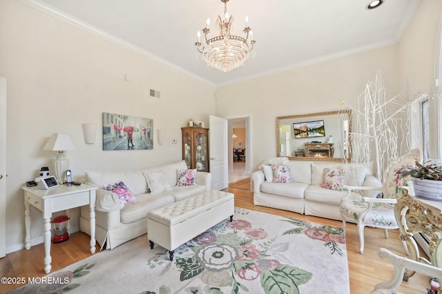 9 Old Cider Mill Rd, Manalapan, NJ 07726 - living area featuring wood finished floors, a chandelier, and crown molding