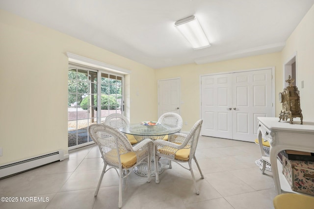 9 Old Cider Mill Rd, Manalapan, NJ 07726 - dining area featuring a baseboard heating unit and light tile patterned floors