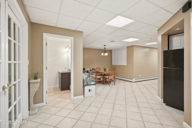 9 Old Cider Mill Rd, Manalapan, NJ 07726 - kitchen with freestanding refrigerator, a baseboard radiator, a drop ceiling, a chandelier, and decorative light fixtures