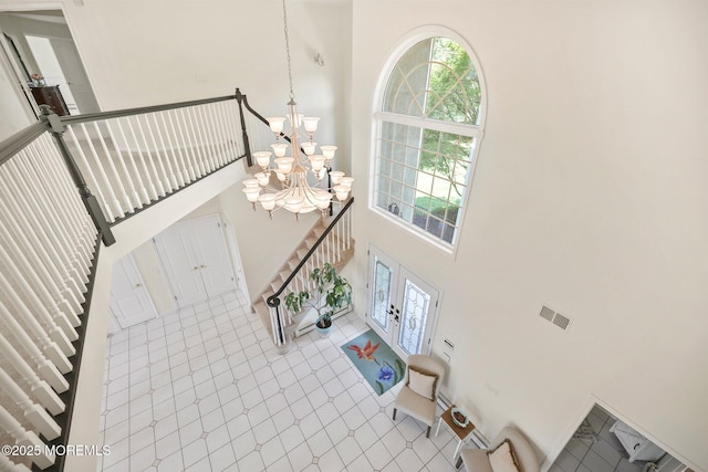 9 Old Cider Mill Rd, Manalapan, NJ 07726 - entrance foyer with a high ceiling, a chandelier, tile patterned floors, and stairway