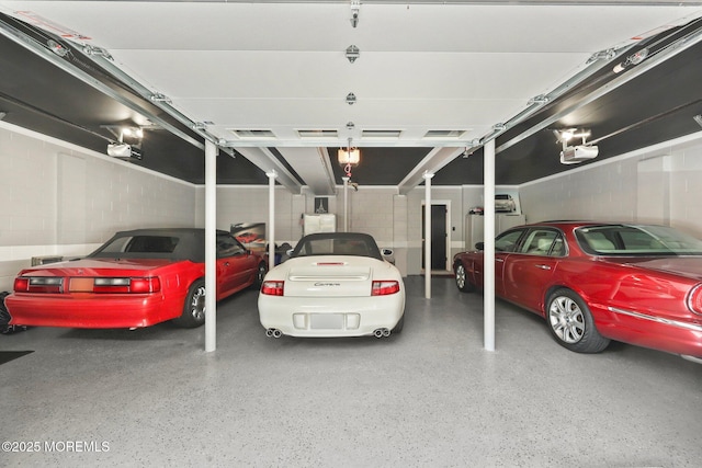 9 Old Cider Mill Rd, Manalapan, NJ 07726 - garage with a garage door opener and concrete block wall
