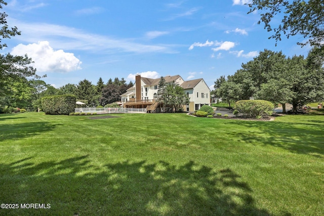 9 Old Cider Mill Rd, Manalapan, NJ 07726 - view of green lawn featuring stairs and a deck
