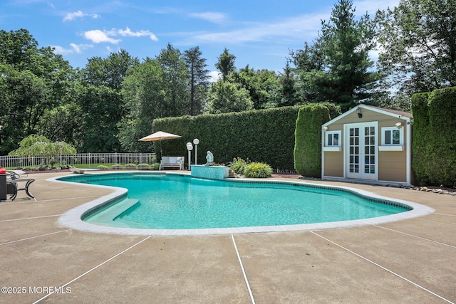 9 Old Cider Mill Rd, Manalapan, NJ 07726 - view of swimming pool featuring a patio area, view of wooded area, an outdoor structure, and a diving board