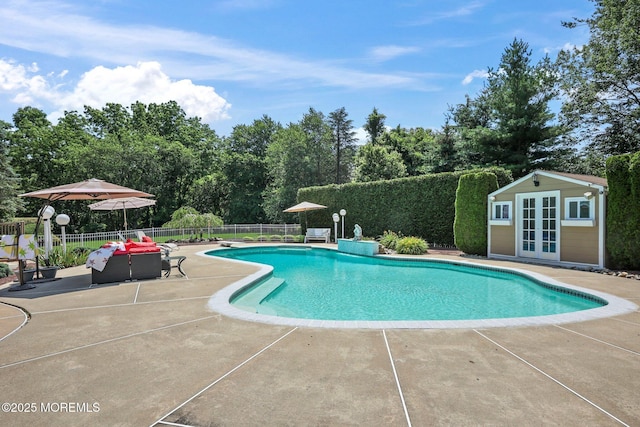 9 Old Cider Mill Rd, Manalapan, NJ 07726 - view of pool with a patio, view of wooded area, and an outbuilding