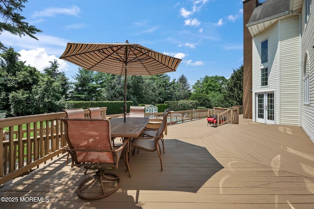 9 Old Cider Mill Rd, Manalapan, NJ 07726 - deck featuring outdoor dining area, french doors, and view of wooded area