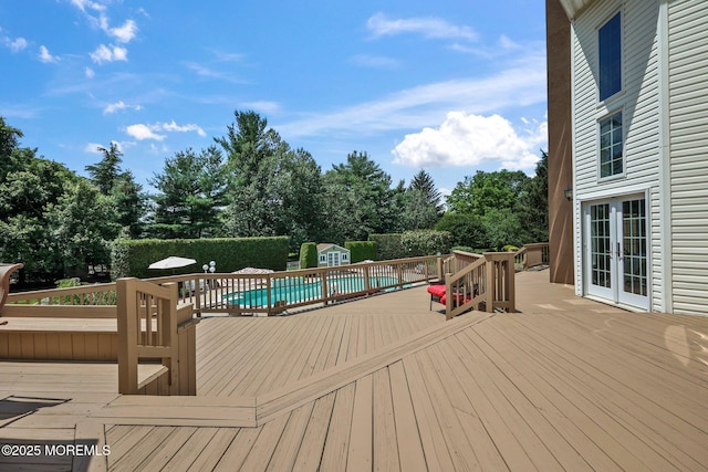 9 Old Cider Mill Rd, Manalapan, NJ 07726 - wooden deck featuring a storage shed, french doors, and view of scattered trees