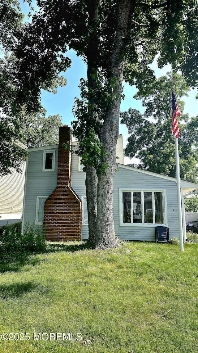 417 Carter Ave, Point Pleasant Beach, NJ 08742 - view of front of home with a front yard and a chimney