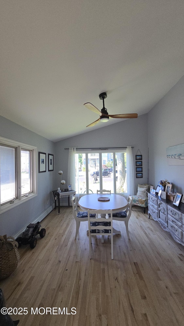 417 Carter Ave, Point Pleasant Beach, NJ 08742 - dining area featuring wood finished floors, vaulted ceiling, ceiling fan, and plenty of natural light