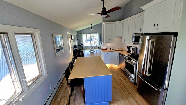 417 Carter Ave, Point Pleasant Beach, NJ 08742 - kitchen with stainless steel appliances, lofted ceiling, ceiling fan, light wood finished floors, and light countertops
