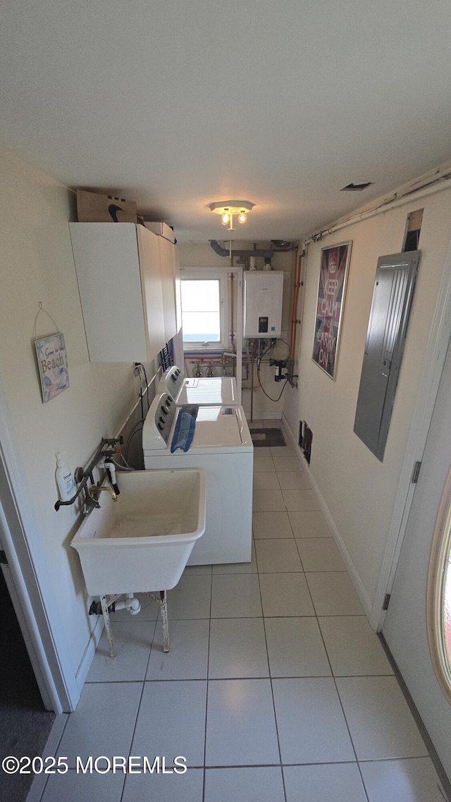 417 Carter Ave, Point Pleasant Beach, NJ 08742 - washroom featuring water heater, electric panel, washing machine and clothes dryer, cabinet space, and light tile patterned floors