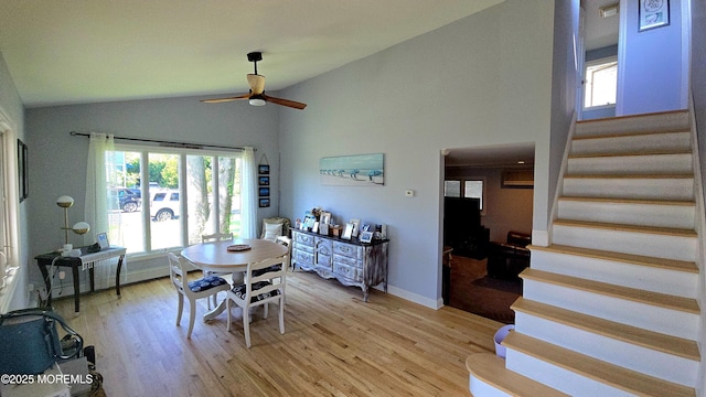 417 Carter Ave, Point Pleasant Beach, NJ 08742 - dining space featuring stairway, ceiling fan, light wood finished floors, plenty of natural light, and high vaulted ceiling
