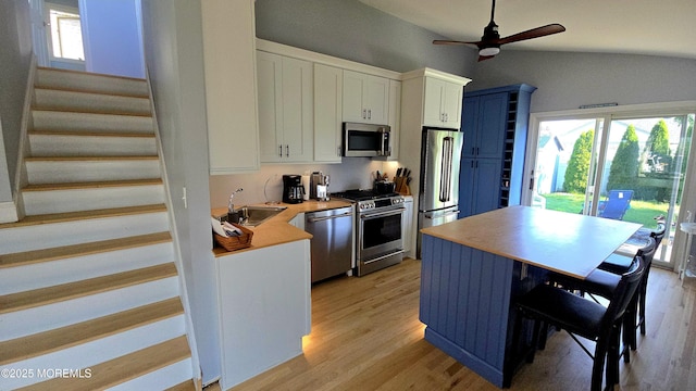417 Carter Ave, Point Pleasant Beach, NJ 08742 - kitchen featuring appliances with stainless steel finishes, light wood-style flooring, white cabinets, ceiling fan, and light countertops