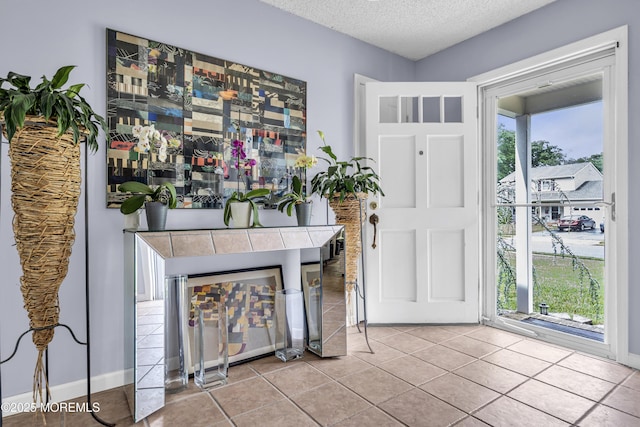 707 Cambridge Rd, Lanoka Harbor, NJ 08734 - entrance foyer featuring a textured ceiling and tile patterned flooring